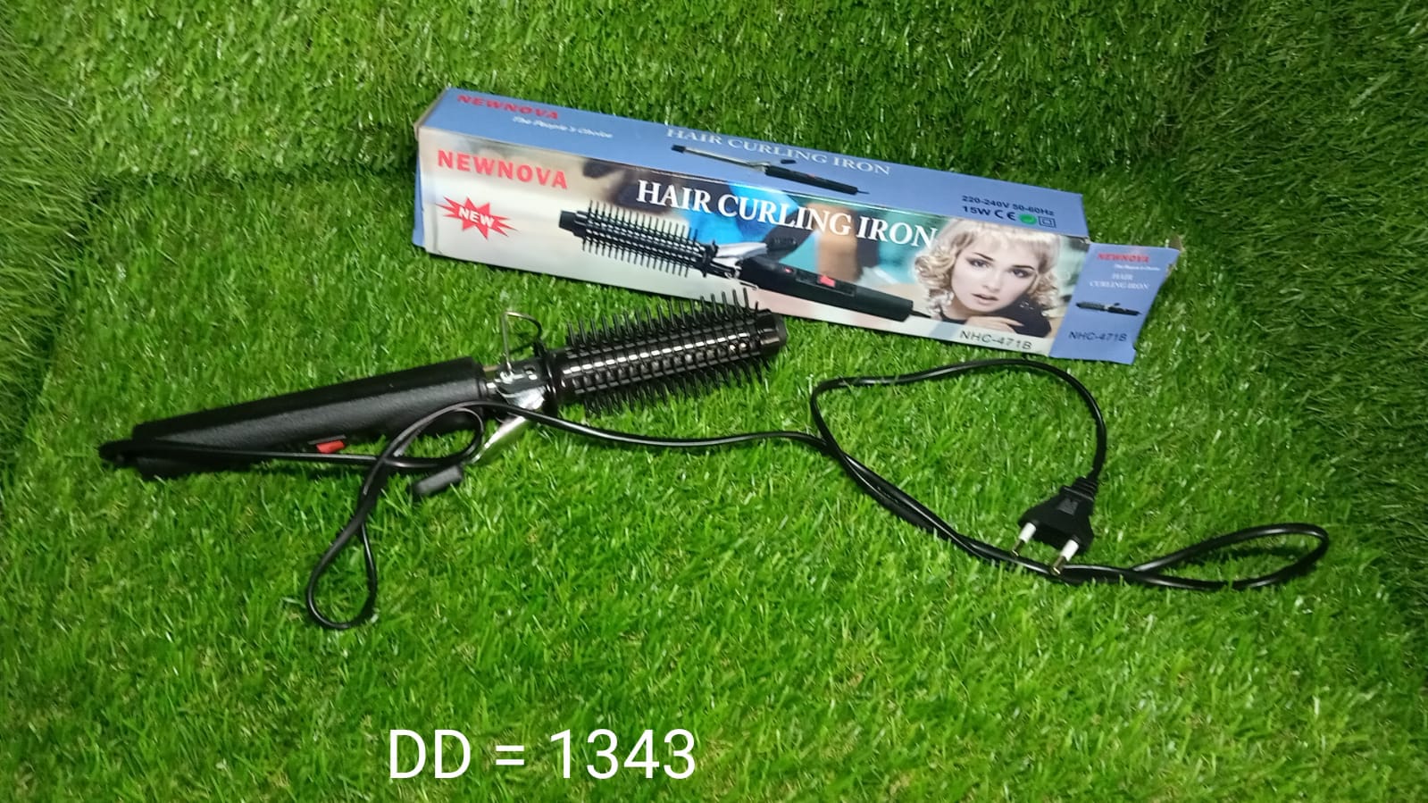 Black curling iron with a heat-resistant tip. Black curling iron with a heat-resistant tip.